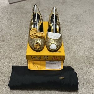 Fendi. Gold cross hatched pattern. 37